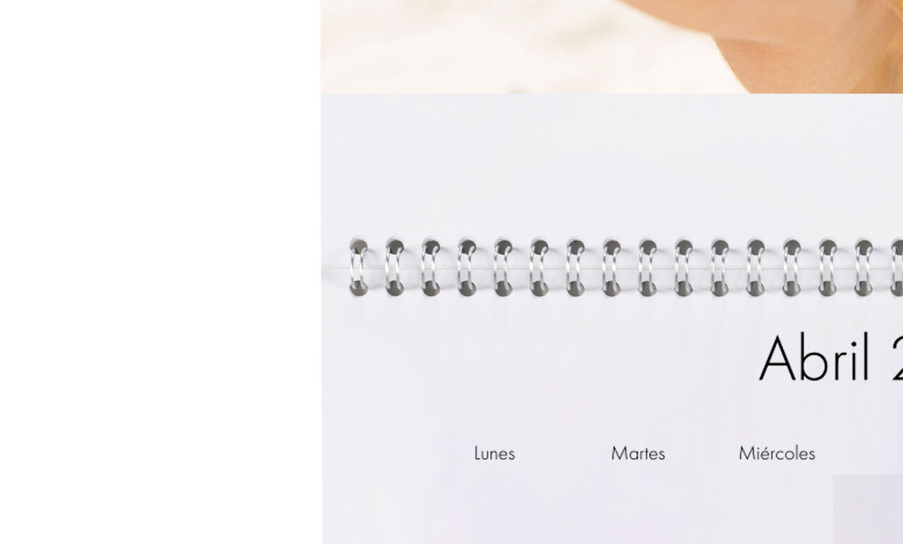 Detalle de un calendario con encuadernación espiral y los meses de abril, lunes, martes y miércoles.
