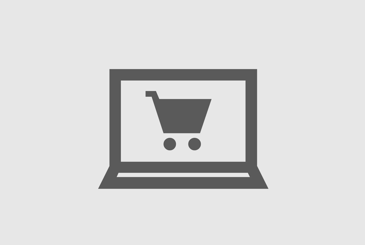 Una laptop con un símbolo de carrito en la pantalla, representando compras online.