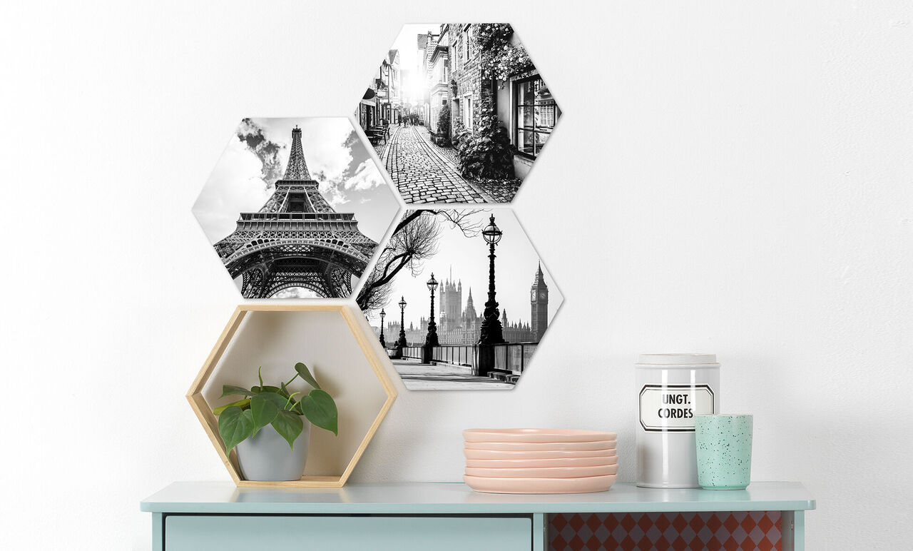 Tres imágenes hexagonales en blanco y negro con la Torre Eiffel, el horizonte de Londres y una calle.